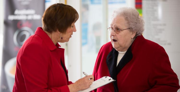 Pensioner answering a questionnaire