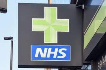 NHS white and blue logo underneath a green pharmacy cross 